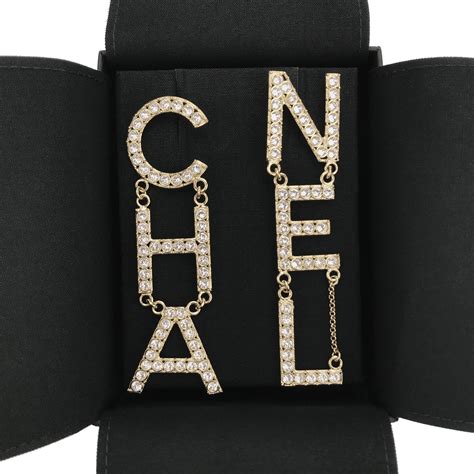 chanel crystal letter logo statement dangle earrings|More.